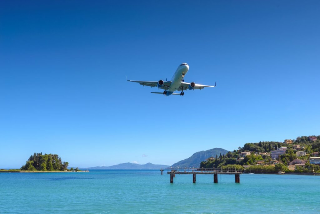 car rental rhodes airport an airplane flying over water