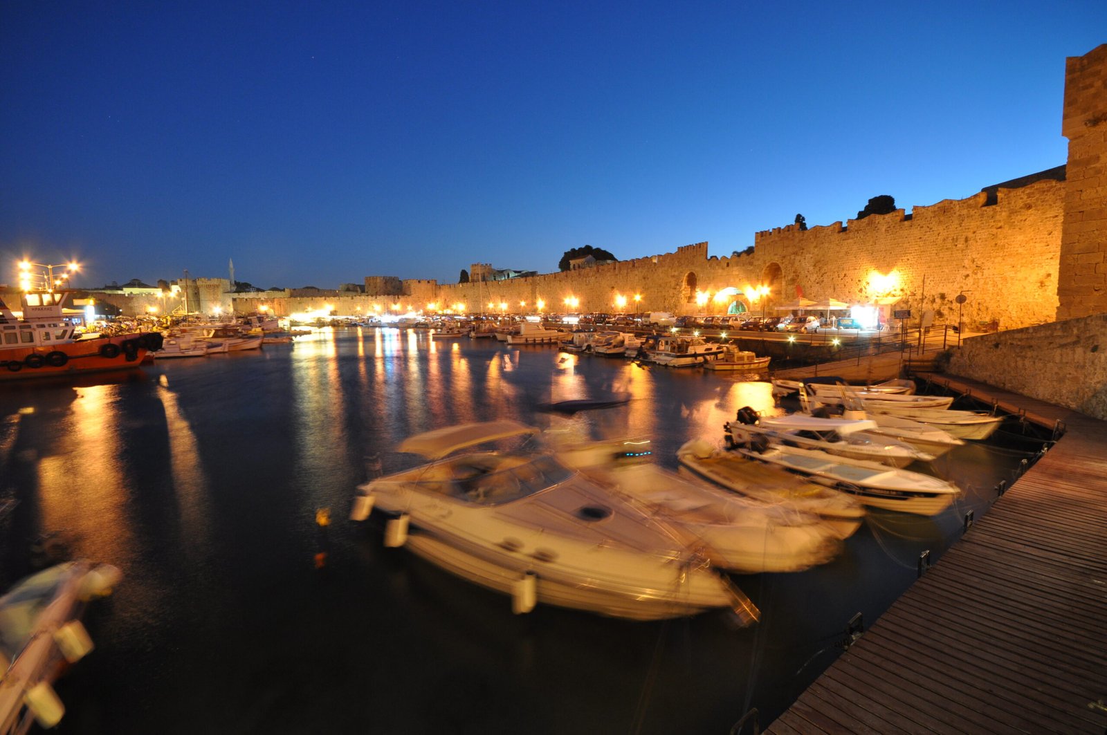 Rhodes Port and the medieval city walls after sunset
