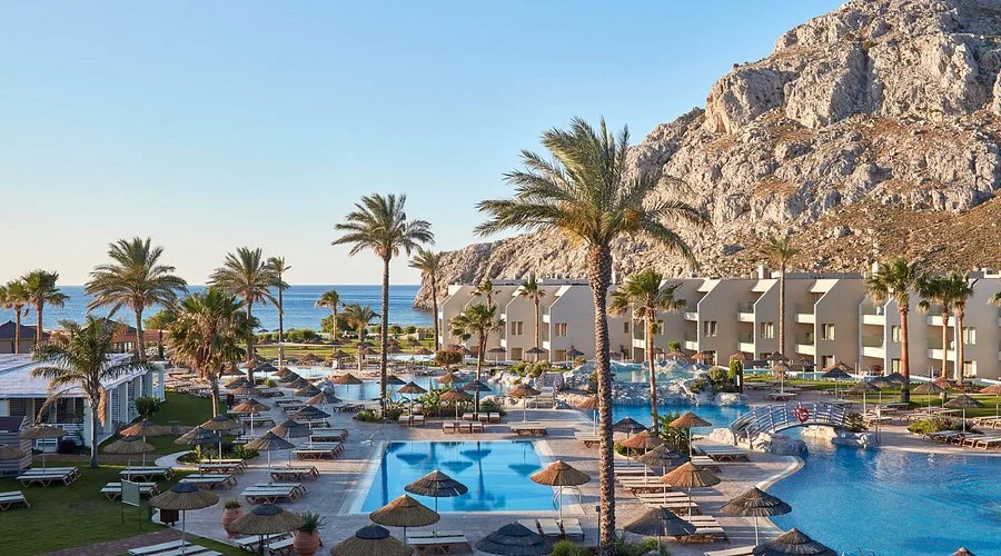 Pools, palm trees and guest buildings of Atlantica Aegean Blue in Kolymbia, Rhodes