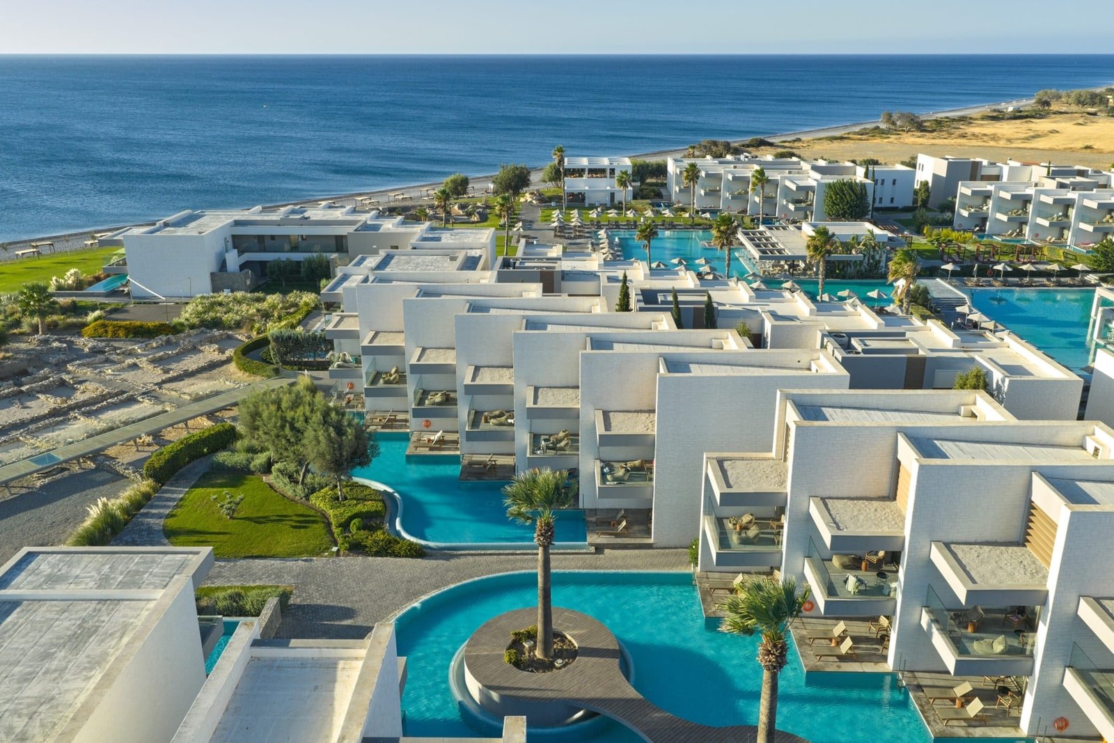 Aerial view of Atlantica Dreams Resort and its pools beside the sea in Gennadi, Rhodes