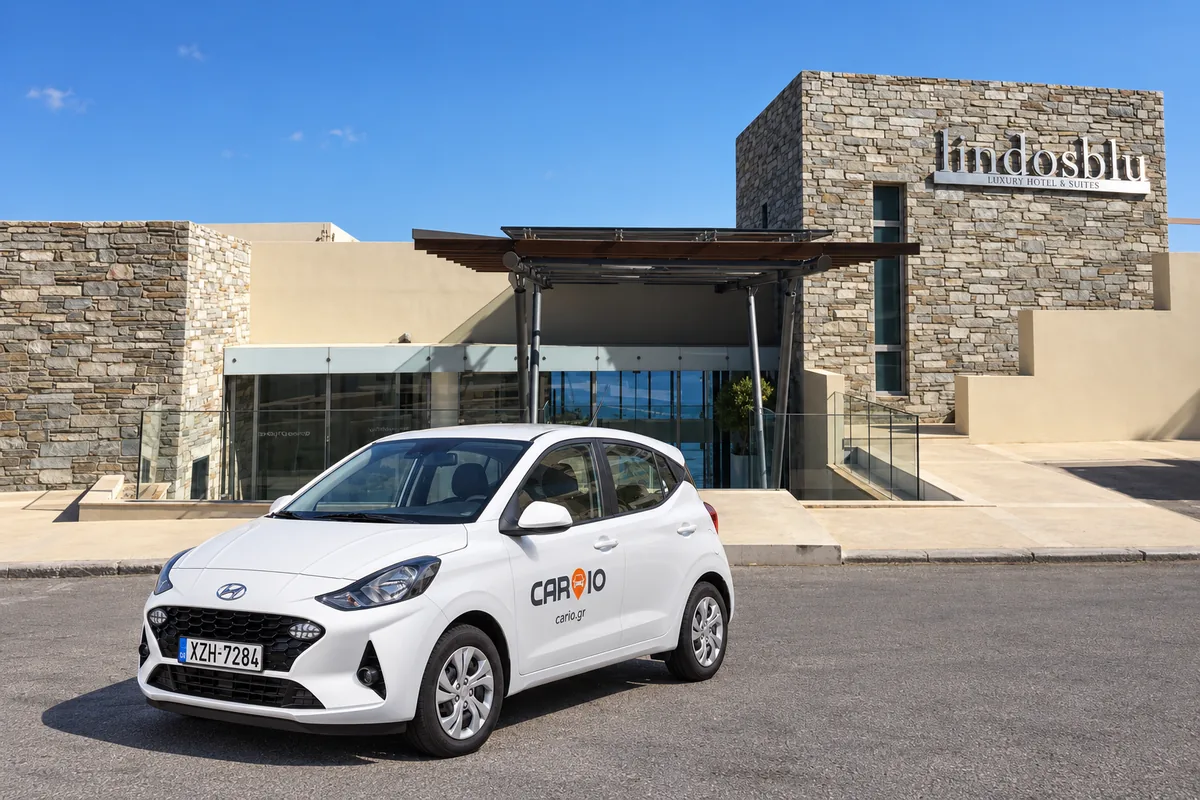 CARIO Hyundai i10 rental car at the entrance of Lindos Blu Luxury Hotel and Suites, Rhodes