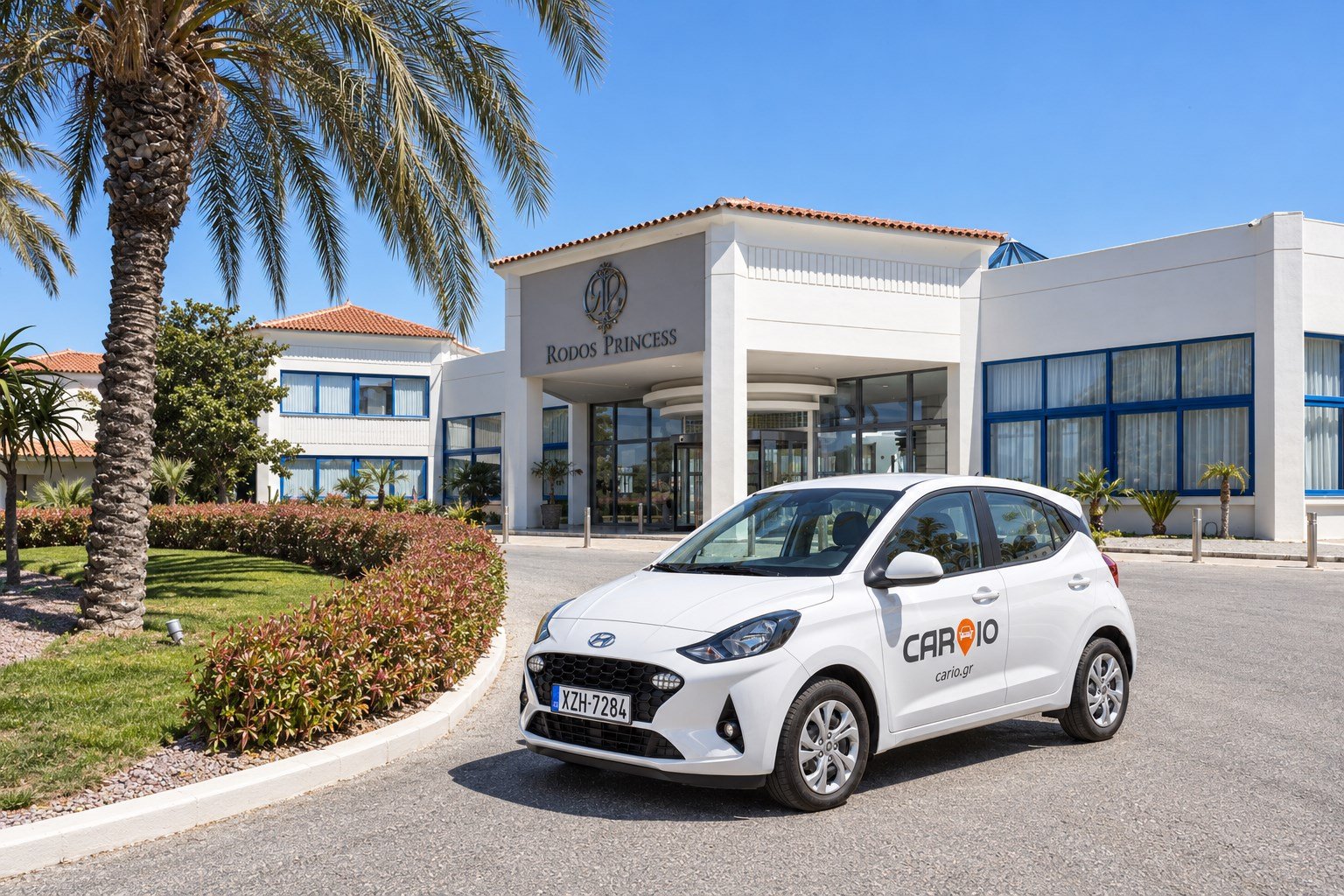 White CARIO rental car outside Rodos Princess Beach, Rhodes