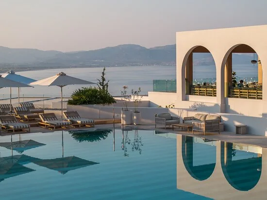 Pool at sunset with sea views at Lindos Mare hotel above Vlycha Bay, Rhodes
