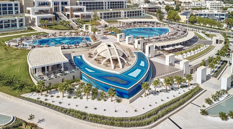 Aerial view of the pools and beachfront gardens of Mayia Exclusive Resort & Spa in Kiotari, Rhodes